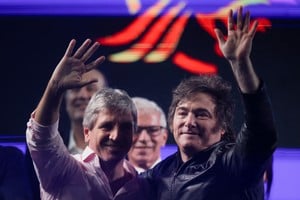 Argentina's President Javier Milei and Economy Minister Luis Caputo wave during a rally in Buenos Aires, Argentina, May 14, 2025. REUTERS/Tomas Cuesta